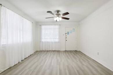 Living room view toward entry door