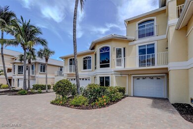 View of front of property with a garage, stucco si