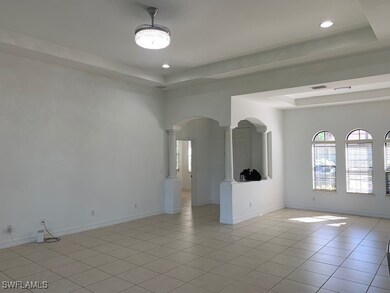 Spare room featuring recessed lighting, a tray cei