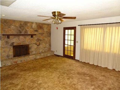 Spacious family room with beautiful woodburning fi