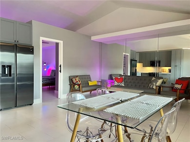 Dining room featuring vaulted ceiling