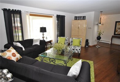 Another view of living room showing stunning wood 