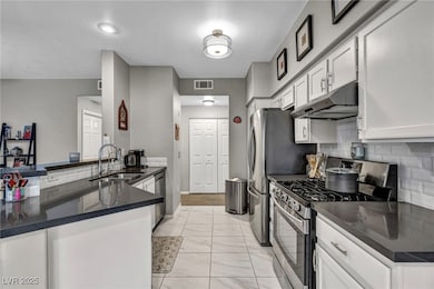 Kitchen featuring appliances with stainless steel