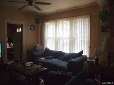 Living Room. UPPER FRONT APT.