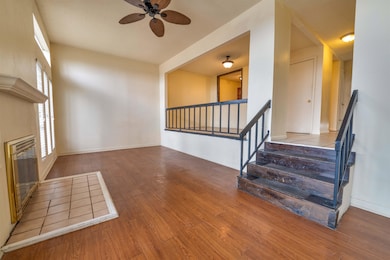 Interior space featuring a ceiling fan, baseboards