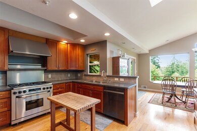 Featuring elegant cherry cabinetry and a professional-grade chef’s range, this kitchen is designed to please seasoned chefs and inspire future culinary enthusiasts alike—where style meets high-performance cooking