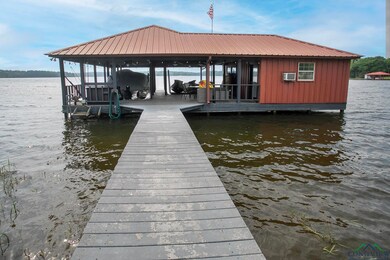 View of dock featuring a water view and boat lift