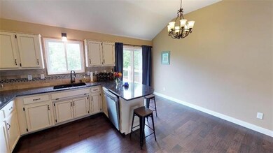 BAR TOP SEATING ON COUNTER & WALKOUT TO BACK DECK.