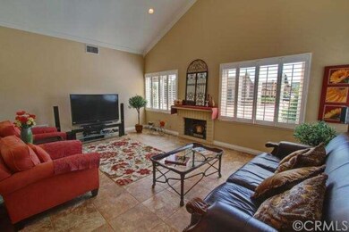 Large family room with a fire place and vaulted ce
