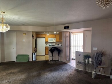 Kitchen featuring a notable chandelier, visible ve