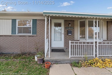 Property entrance with brick siding and covered porch