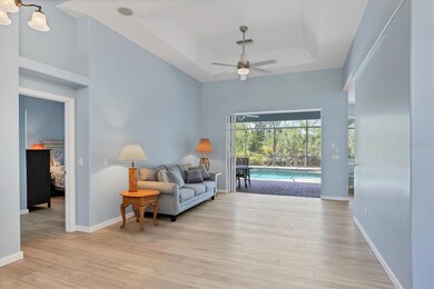 Sitting room adjoining Primary Suite and tall pocket sliders.