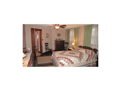 Large and charming Master Bedroom with hardwood fl