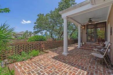 View of patio with a ceiling fan and entry steps