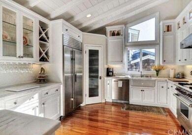 Bright, open kitchen features a subzero refrigerat