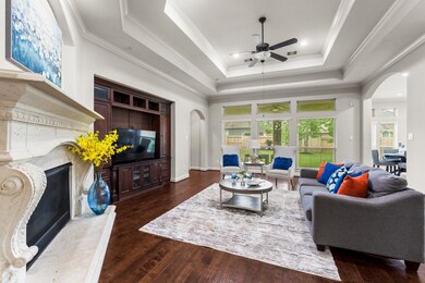This stunning family room boasts exquisite tray ce