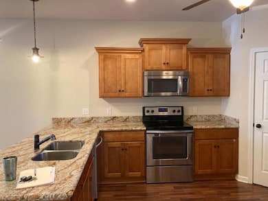 Classy kitchen with granite counter tops, and shak