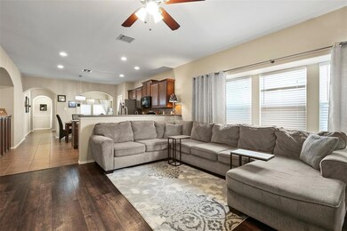 The living room is open to the kitchen and eating 