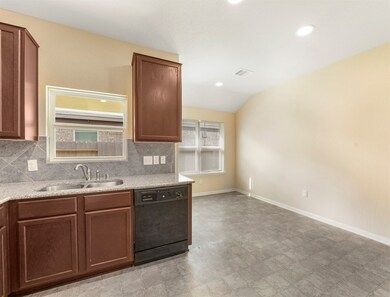 Dining room is adjacent to kitchen. Perfect for en