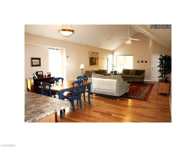 Great Room and Dining Room with hardwood floor.