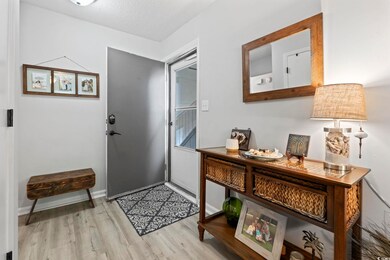 Entrance foyer featuring light wood-style flooring