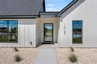 View of exterior entry featuring board and batten