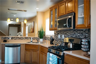 Kitchen featuring appliances with stainless steel