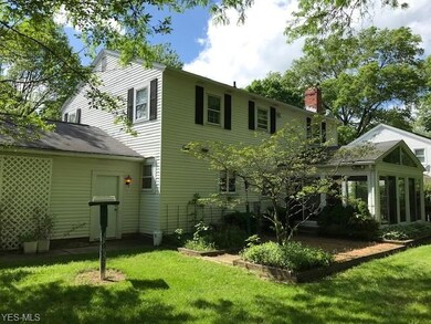 EXTERIOR BACK VIEW - MAN DOOR OFF GARAGE - SUNRM A