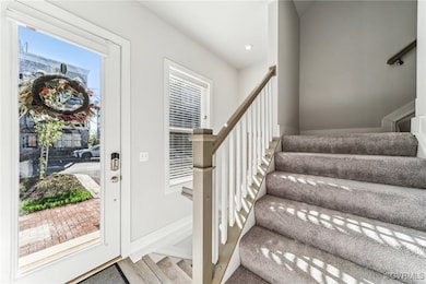 Foyer with recessed lighting, wood finished floors