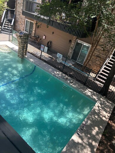 Community pool featuring a patio