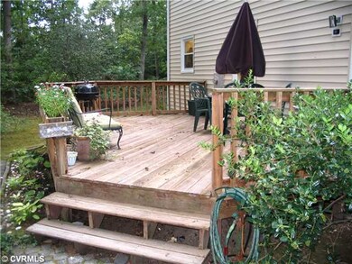 Exterior Back - Large deck, that you can enter fro