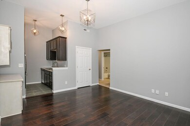 Living room and kitchen with a coat closet and add