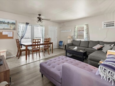 Living area featuring a wall mounted AC, plenty of