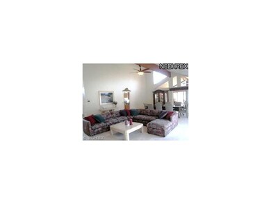 FULL WINDOW WALL BATHES THE LIVING ROOM AND  DININ