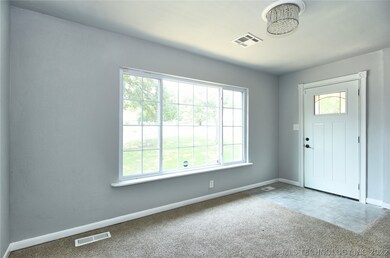 Large window in entry way for natural light and vi