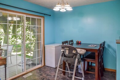 The dinette has sliding doors to the back deck.