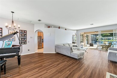 Living room featuring an inviting chandelier and d