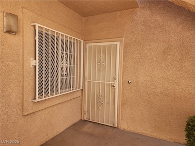 Property entrance with stucco siding