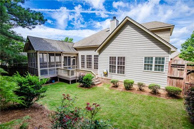 Fenced-in backyard and mature landscaping make thi