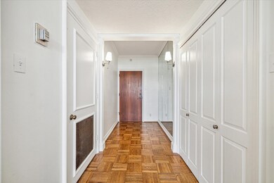 Enter this third floor pied a terre down a lovely