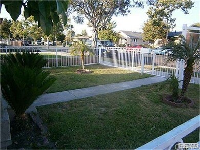 Large front yard with fence