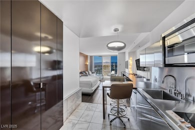 Kitchen with stainless steel counters, modern cabi