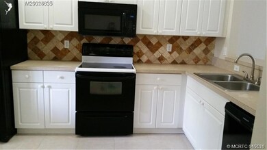 Kitchen has newer appliances. Tile floor throughou