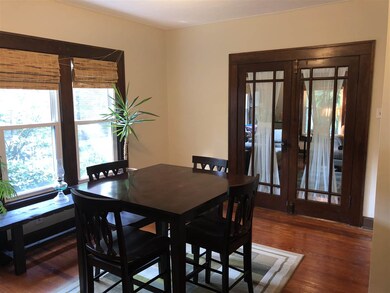 Dining room with closed french doors leading to th