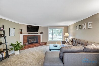 Main floor living room with gas fireplace.