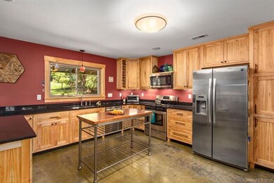 Large Kitchen with Custom Cabinetry and Granite counter tops.