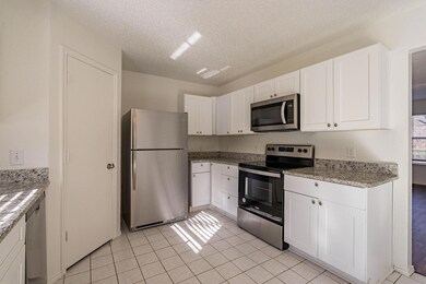 Kitchen with stainless steel appliances, light til