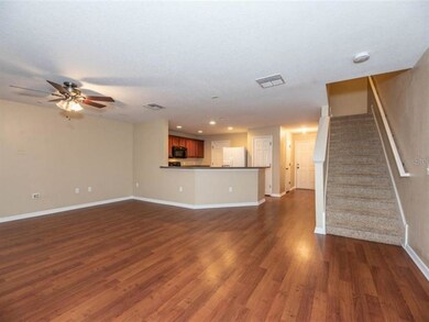 Great room and kitchen have laminate flooring.