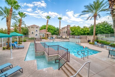 Community pool with a patio