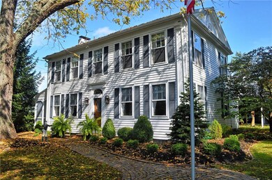 Stately Greek Revival home with brick walkway